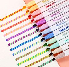 several markers are lined up on a sheet of paper with the words magic written in them