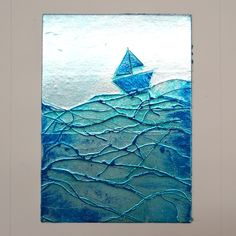 a blue and white painting with a sailboat in the ocean on it's side