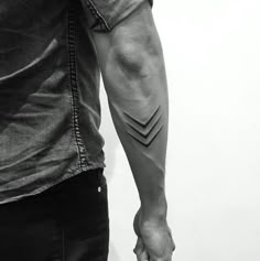 a man with a tattoo on his arm