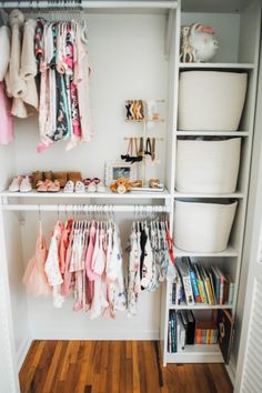 the closet is full of baby clothes and other things to put in it's storage area