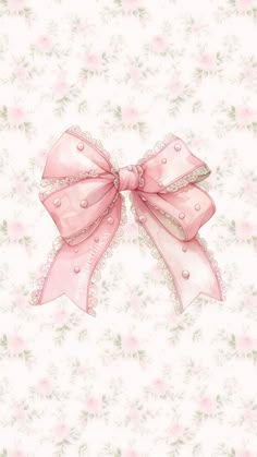 a pink bow on top of a white wallpaper with flowers and leaves in the background