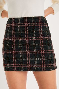 Step into fall looking effortlessly chic in the Lulus Timelessly Cute Black and Pink Plaid Tweed Mini Skirt! Woven tweed, with a white, pink, and emerald green plaid pattern, shapes a high waist and a cute A-line silhouette, perfect for pairing with your favorite boots. Mini hem completes the look. Hidden zipper/clasp at back. Fit: This garment fits true to size. Length: Mid-thigh. Size medium measures 16" from waist to hem. Waist: Fitted - very fitted at natural waist. Hip: Loosely Fitted. Fabr Casual Tweed Mini Skirt With Lining, Spring Tweed Mini Skirt, Pink Plaid Tweed Skirt, Trendy Plaid High-waist Mini Skirt, Casual Plaid Mini Skirt With Lined Detail, Tweed Mini Skirt, A Line Mini Skirt, Favorite Boots, Plaid Mini Skirt