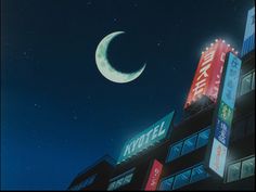 the moon shines brightly in the night sky above a building with neon signs on it