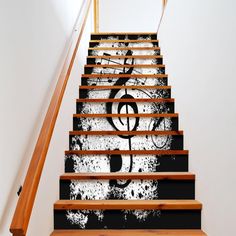 an artistic stair case painted with music notes