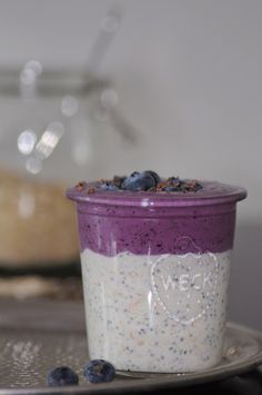 a bowl of oatmeal with blueberries and chia seeds in it