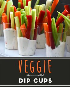 small cups filled with different types of veggies on top of a white table