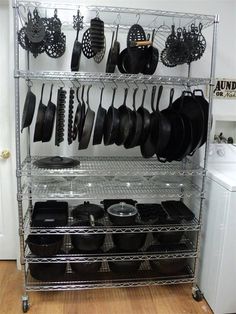 a rack with pots and pans on it