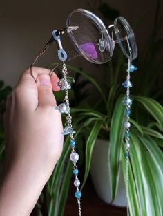 Introducing a glasses chain inspired by the enchanting bluebell flowers. This delicate piece features intricate flower beads, complemented by soothing aquamarine beads and imitation pearls. Designed to add a touch of femininity to your eyewear, this chain is as elegant as it is functional. Elevate your accessory game with this enchanting wisteria-inspired glasses chain. This eyeglass chain might be slightly heavier than regular chains because of some stone beads and crystals. Actual colors of an Cheap Glasses Chains With Colorful Round Beads, Glasses Accessories Jewelry, Chains For Glasses, Cute Glasses Chain, Whimsical Blue Jewelry For Parties, Blue Beaded Glass Glasses Chains, Whimsical Adjustable Beaded Chain Jewelry, Handmade Adjustable Blue Glasses Chains, Handmade Blue Glasses Chains For Festivals