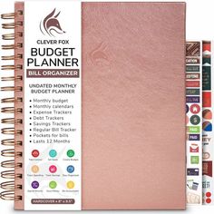 a pink planner book with stickers on it