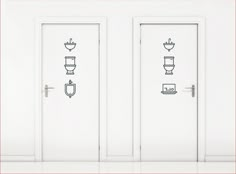 two white doors with toilets drawn on them