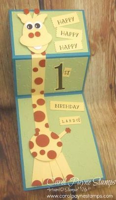 a birthday card with a giraffe on it's front and the number one on its back