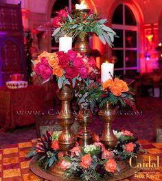 a table with candles and flowers on it