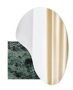 a mirror that is on top of a marble countertop next to a green and white wall