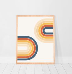 a framed art print with an abstract design in orange, blue, and yellow colors