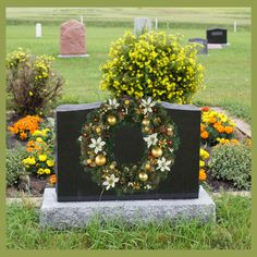 a wreath is placed in front of a grave