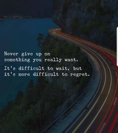 a highway with the words never give up on something you really want it's difficult to wait, but it's not difficult to respect