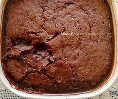 a brownie in a white dish on a doily