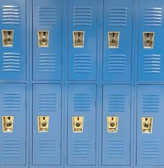 a row of blue lockers with gold handles