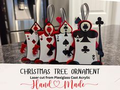 Add a touch of whimsy and charm to your holiday decor with these unique Card Soldier Laser Cut Christmas Tree Ornaments standing at 4.5 inches tall and 3.5 inches wide.  Inspired by the classic tale of Alice in Wonderland, these ornaments are meticulously crafted from plexiglass acrylic, ensuring durability and a beautiful finish. Each ornament features intricate laser-cut details that bring the card soldiers to life, making them a standout addition to any Christmas tree or wonderland themed wreath. Perfect for fans of Alice in Wonderland or anyone looking to add a unique twist to their holiday decorations, these ornaments also make wonderful gifts for friends and family. Whether you're decorating your own tree or looking for the perfect holiday gift, these card soldier ornaments are sure Alice In Wonderland Christmas Ornaments, Alice In Wonderland Christmas Tree Ideas, Alice And Wonderland Christmas Tree, Alice In Wonderland Christmas Decor, Alice In Wonderland Card Soldiers, Alice In Wonderland Ornaments, Alice In Wonderland Christmas Tree, Card Soldiers, Laser Cut Christmas Tree