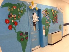 a bulletin board with christmas decorations on it in an office building or school hallway area