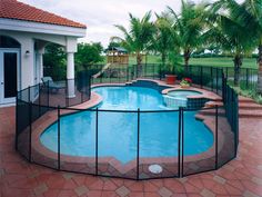 a swimming pool with a fence around it