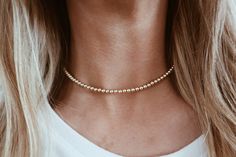 This is a beautiful and classic beaded chain choker. The entire chain is made out of individual 14k gold filled beads. Pictures: 14.5 inches Dainty Choker With Round Gold Beads, Gold Beaded Everyday Chain Necklace, Dainty Gold Bead Choker Necklace, Dainty Gold Beaded Choker Jewelry, Gold Choker With Tiny Beads, Gold Beaded Minimalist Chain Necklace, Gold Choker With Tiny Round Beads, Elegant Beaded Necklaces With 14k Gold Filled Beads, Classic Gold Beaded Necklaces For Everyday