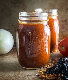 two mason jars filled with homemade tomato sauce