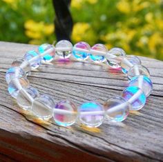 Last Day to get This Rainbow Quartz Bracelet for 50% Off! #etsy #bracelet #angelauraspirit #angelaurabracelet #mermaidglass #angelaura #angelauraquartz #crystalbracelet #rainbowaura Stone Angel, White Aura, Jewelry Royal, Crystals Quartz, Rainbow Aura Quartz, Aura Quartz Crystal, Mermaid Glass, Spring Bracelet, Art Rainbow