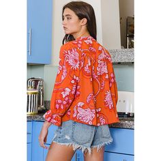 BucketList Orange and Red 100% Polyester Long Sleeve Crewneck 3/4 Sleeves Bell Sleeves Ruffled Details T2239-ORANGE Make a bold statement with the BucketList Women's Orange and Red Floral Crepe Blouse. Crafted from lightweight crepe fabric, this blouse offers both comfort and style for any occasion. The vibrant orange and red floral pattern adds a pop of color to your ensemble, instantly brightening your look. With its versatile design, this blouse can be dressed up with trousers for a polished Trendy 3/4 Sleeve Blouse For Brunch, Red 3/4 Sleeve Summer Blouse, Bold Red Tops For Spring, Casual Red Blouse With 3/4 Sleeves, Casual Orange Tops With 3/4 Sleeves, Casual Orange Top With 3/4 Sleeves, Casual Orange 3/4 Sleeve Top, Red 3/4 Sleeve Blouse For Spring, Chic Red Top With 3/4 Sleeves