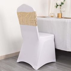 a white chair sitting next to a table