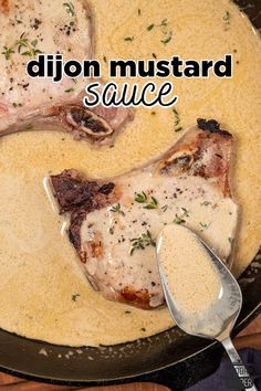 two pieces of meat are in a skillet with some sauce on it and the words dijon mustard sauce above them