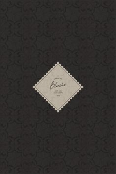 a black book with an ornate design on the cover