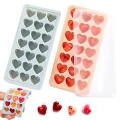 two heart shaped ice trays and one with hearts on it, both in plastic