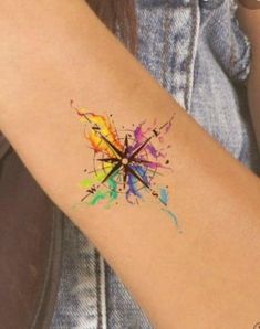 a person with a colorful tattoo on their arm