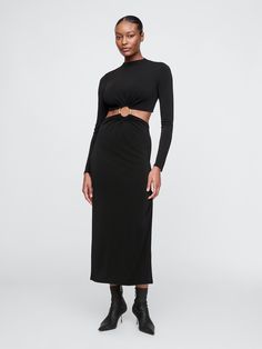 Soft, stretch maxi dress.  ​ Mockneck.  ​ Long sleeves.  ​ Cutout detail at waist with gold O-ring.  ​ Zipper at back.  ​ Fit: Slim.  A shift silhouette that's slim & straight through the body.  ​ Hits at the waist.  ​ Model is 5’9” and wearing a Gap Modern Goddess, Cutout Maxi Dress, Into Art, Cult Gaia, O Ring, Mock Neck, Turning, Gap, Long Sleeves