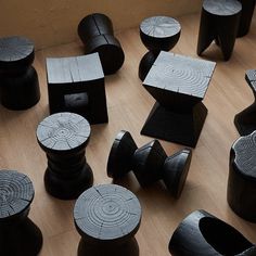 several wooden stools are arranged on the floor