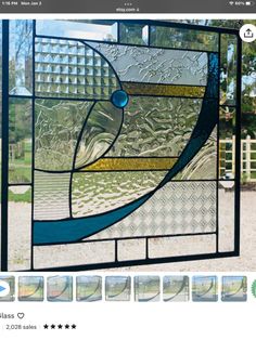 an image of a stained glass window in the shape of a fish with waves on it