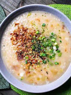 a bowl filled with soup on top of a green cloth