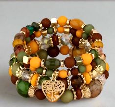 Indulge in the epitome of fall elegance with this Autumn colored bracelet. Featuring a rich and captivating color palette inspired by a walk in the woods, this bracelet is created using a variety of colored beads. Elevate your style and embrace the luxuriousness of the season with this exclusive piece. Good year-round too! It also makes a great gift as it's one-size-fits-all. Free shipping, 8-13 days delivery. Autumn Bracelet, A Walk In The Woods, Wood Pallet Art, Chic Bracelet, 13 Days, 20 Gifts, Walk In The Woods, Wood Home Decor, Pink Bracelet