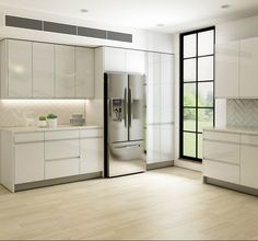 a modern kitchen with white cabinets and stainless steel appliances