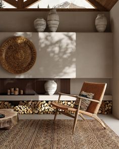 a living room filled with furniture next to a firewood log pile and a wall mounted tv