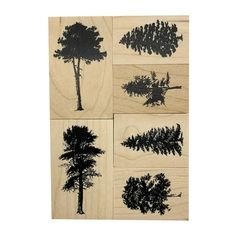 four rubber stamps with trees on them