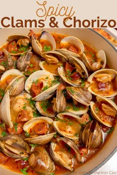 clams and chorizzo in a pan with bread on the side