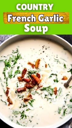 a bowl of soup with bacon, spinach and cheese in it on a table