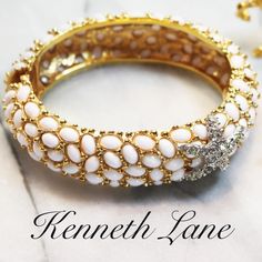 We Present One Of His Most Exquisite Pieces With Detailed Prongs Forming Glimpses Of Glittering Gold Against Pure White Lacquer Cabochons And Finished Off, Like A Piece Of Art, With A Bright, Dazzling Pave Crystals Encrusted In Silver Starfish. This Piece Is Signed Kjl, Measures 7"L X 7/8"W, Weighs 2.1 Oz. And Has A Spring Hinge Clasp. This Piece Is In Excellent Vintage Condition And Would Make A Beautiful Gift For Collectors. #Hamptonjewelry #Kennethlane These Bracelets Are Sold Individually In White Bangle With 17 Jewels, Luxury White Rhinestone Jewelry, White Rhinestone Jewelry, White Bangle With Sparkling Stones, White Sparkling Stones Bangle, White Sparkling Stones Costume Jewelry, White Costume Jewelry With Sparkling Stones, White Jeweled Bangle, Formal White Jeweled Jewelry