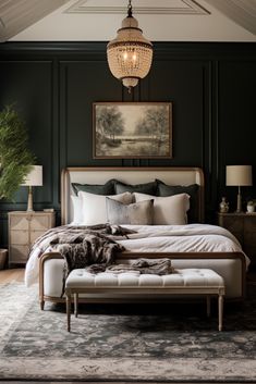 a large bed sitting under a chandelier next to a painting on the wall