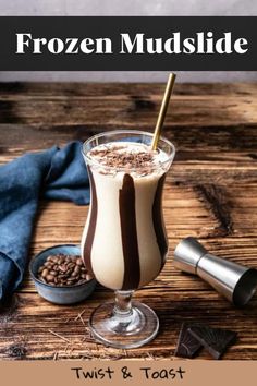 frozen mudslide in a glass on a wooden table with chocolate and coffee beans