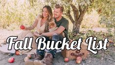 a man and woman sitting in an apple orchard with the words fall bucket list