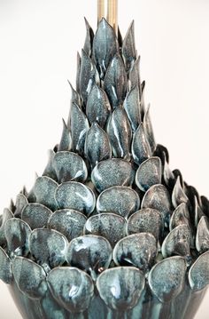 a blue vase filled with lots of water drops