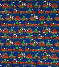 a blue christmas fabric with trains and trees